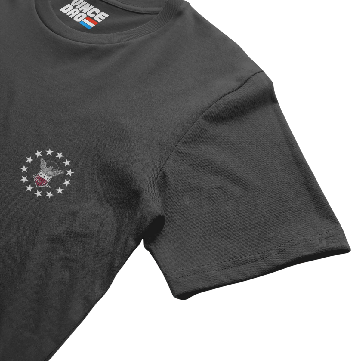 Charcoal t-shirt shown at an angle, showing the sleeve and chest emblem